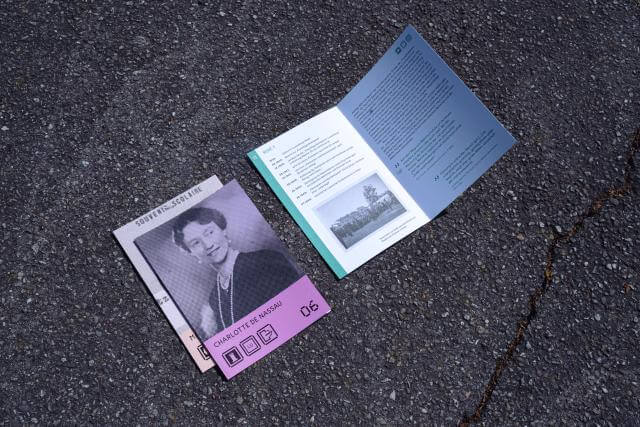 a brochure on the floor, showing a portrait of Grand Duchess Charlotte