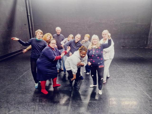 Group photo of people during a rehearsal.