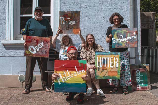 Five people with signs.