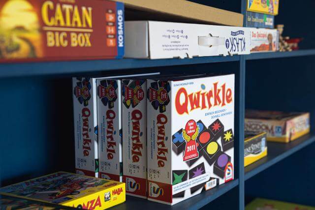 boardgames in a cupboard