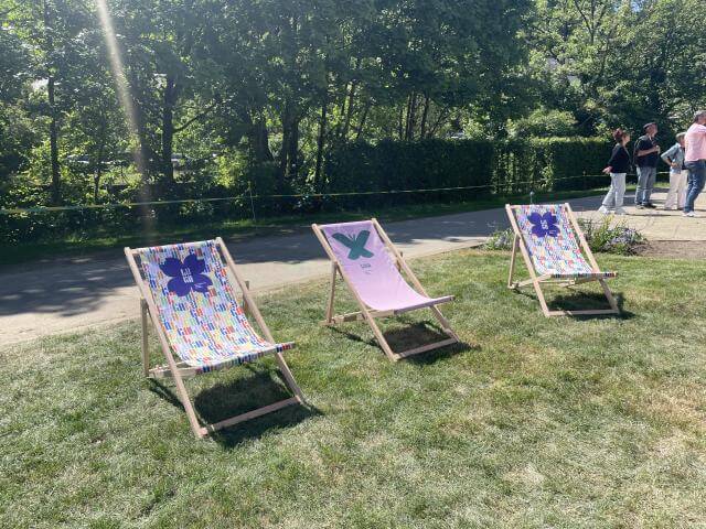 deckchairs on a lawn in a park