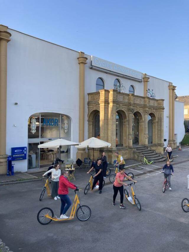persons on bikes and scooters
